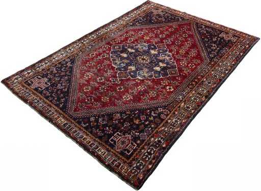 Corner detail of 2000s Shiraz rug showing border pattern and Wool pile