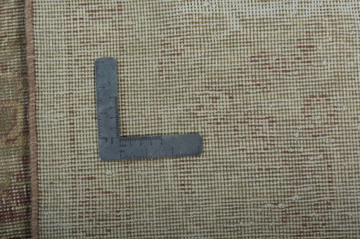 Backside of handmade 1950s Vintage rug showing knot structure and weave density