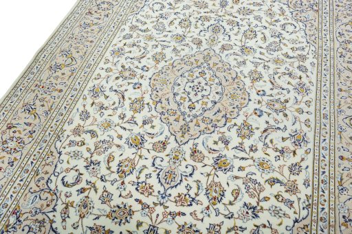 Backside of handmade 2000s Kashan rug showing knot structure and weave density