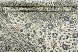 Close-up detail of 2000s Kashan rug from Iran / Persia showing Wool weave