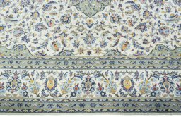 Corner detail of New Kashan rug showing border pattern and Cork pile