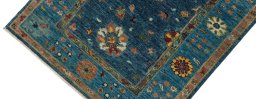 Backside of handmade New Farahan rug showing knot structure and weave density