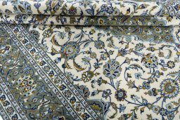 Close-up detail of 2000s Kashan rug from Iran / Persia showing Wool weave
