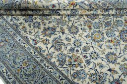 Close-up detail of 2000s Kashan rug from Iran / Persia showing Wool weave