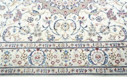 Corner detail of 2000s Nain rug showing border pattern and Wool pile