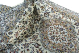 Surface texture of 2000s Kashan rug with natural Wool and intricate pattern