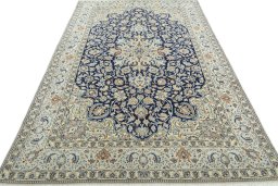 Surface texture of 2000s Nain rug with natural Wool and intricate pattern