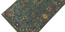 Backside of handmade New Farahan rug showing knot structure and weave density