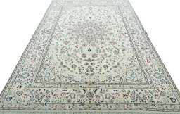 Surface texture of 2000s Nain rug with natural Wool and intricate pattern