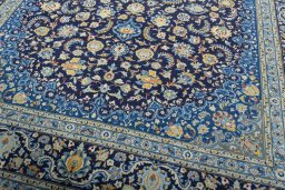 Close-up detail of 2000s Kashan rug from Iran / Persia showing Wool weave