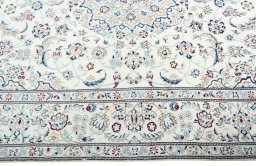 Corner detail of 2000s Nain rug showing border pattern and Wool pile