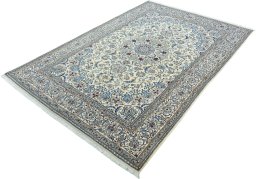 Corner detail of 2000s Nain rug showing border pattern and Wool pile