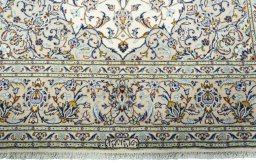 Close-up detail of 2000s Kashan rug from Iran / Persia showing Wool weave