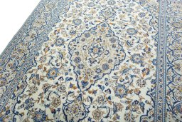 Backside of handmade 2000s Kashan rug showing knot structure and weave density