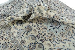 Surface texture of 2000s Nain rug with natural Wool and intricate pattern