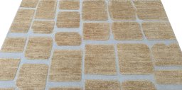 Backside of handmade New Morocco rug showing knot structure and weave density