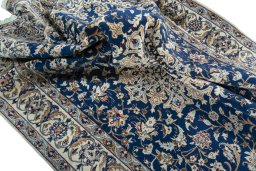 Surface texture of 2000s Nain rug with natural Wool and intricate pattern