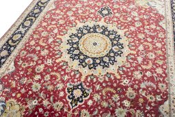 Backside of handmade 2000s Tabriz 50/60/70 Raj rug showing knot structure and weave density