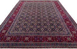 Surface texture of 2000s Mashad rug with natural Wool and intricate pattern