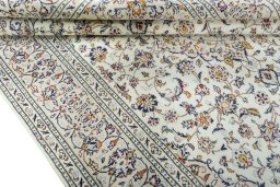 Close-up detail of 2000s Kashan rug from Iran / Persia showing Wool weave