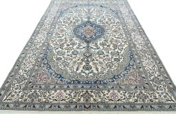 Surface texture of 2000s Nain rug with natural Wool and intricate pattern