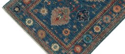Backside of handmade New Kazak rug showing knot structure and weave density