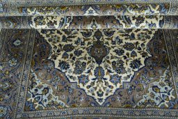 Close-up detail of 2000s Kashan rug from Iran / Persia showing Wool weave