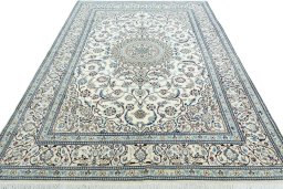Surface texture of 2000s Nain rug with natural Wool and intricate pattern