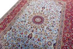 Backside of handmade 2000s Kashan rug showing knot structure and weave density