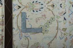 Backside of handmade New Kashan rug showing knot structure and weave density