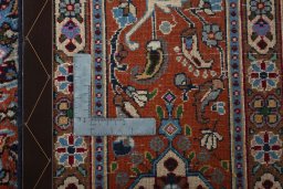 Backside of handmade 2000s Moud rug showing knot structure and weave density