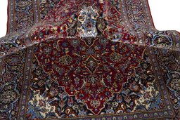 Surface texture of 2000s Kashan rug with natural Cork and intricate pattern