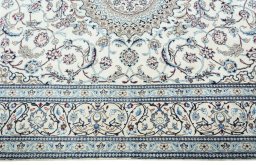 Corner detail of 2000s Nain rug showing border pattern and Wool pile