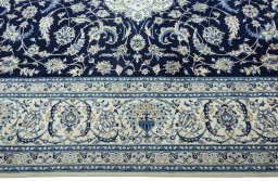Corner detail of 2000s Nain rug showing border pattern and Wool pile