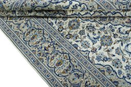 Close-up detail of 2000s Kashan rug from Iran / Persia showing Wool weave