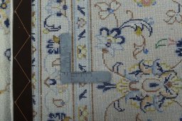 Surface texture of 2000s Kashan rug with natural Wool and intricate pattern