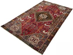 Corner detail of 2000s Shiraz rug showing border pattern and Wool pile