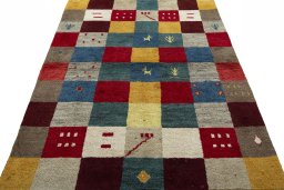 Surface texture of 2000s Persian Gabbeh rug with natural Wool and intricate pattern