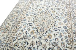 Backside of handmade 2000s Kashan rug showing knot structure and weave density