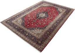 Corner detail of 2000s Kashan rug showing border pattern and Wool pile