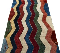 Surface texture of 2000s Persian Gabbeh rug with natural Wool and intricate pattern