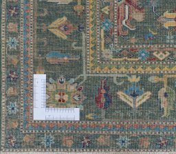 Corner detail of New Kazak rug showing border pattern and Wool pile