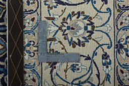 Backside of handmade 2000s Nain rug showing knot structure and weave density