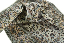 Surface texture of 2000s Kashan rug with natural Wool and intricate pattern