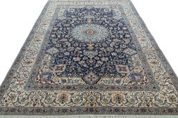 Surface texture of 2000s Nain rug with natural Wool and intricate pattern