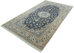 Corner detail of 2000s Nain rug showing border pattern and Wool pile