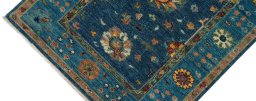 Backside of handmade New Farahan rug showing knot structure and weave density