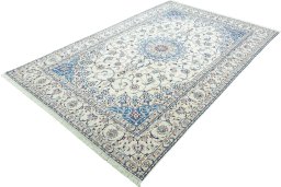 Corner detail of 2000s Nain rug showing border pattern and Wool pile
