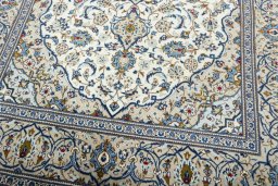 Close-up detail of 2000s Kashan rug from Iran / Persia showing Wool weave