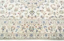 Corner detail of New Kashan rug showing border pattern and Wool pile